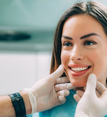 Dentist examining a patient’s smile