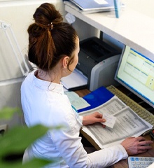 Dental office manager, helping to file insurance claims