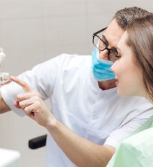 clear model jaw with an implant bridge in it