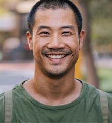 Man smiling outdoors