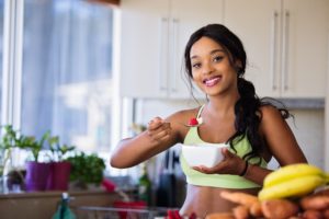 Woman eating fresh fruit